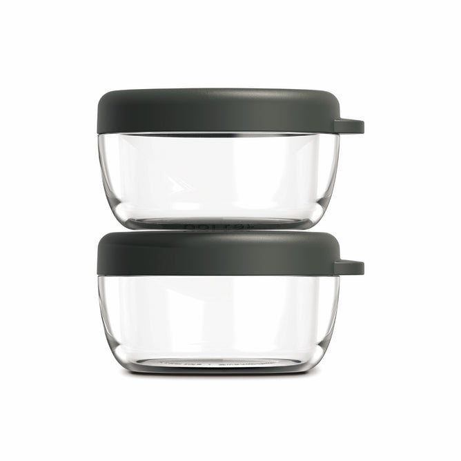 Two clear round W&P Dressing Containers with dark gray lids are stacked together against a white background—ideal reusable containers for Bento Box accessories.