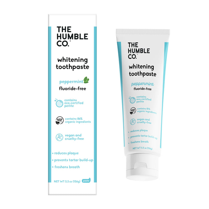 Tube and box of The Humble Co. Whitening toothpaste, peppermint flavor. Labels note it is cruelty-free, vegan, fluoride-free, eco-certified, made with eco-friendly ingredients, and helps reduce plaque and freshen breath.