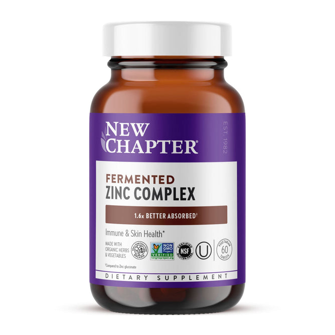 A brown glass bottle of New Chapters Fermented Zinc Complex, known for immune support, features 1.6x Better Absorbed on its label along with organic and NSF certifications. It contains 60 skin-nourishing tablets.