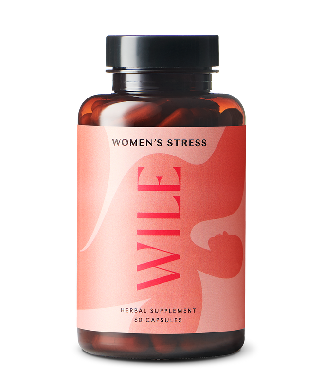 A bottle of WILEs Stress herbal supplement for women 40+ supports stress resilience and hormonal balance. It contains 60 capsules in an amber bottle with a black cap and a pink label featuring striking red text.
