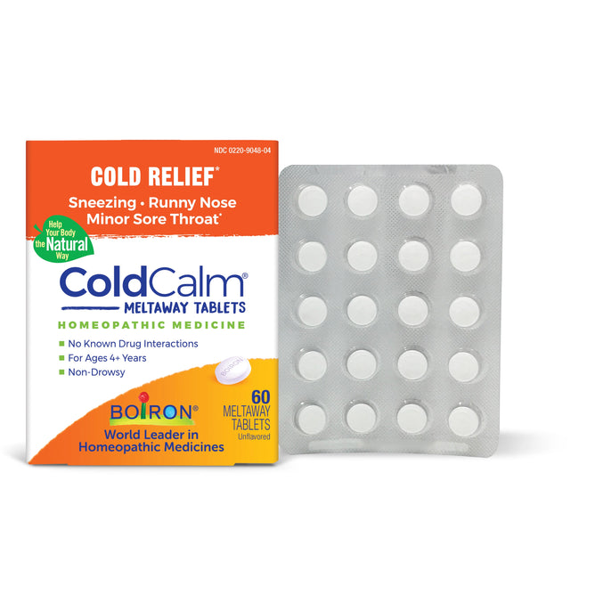 A ColdCalm Tablets package from Boiron is shown alongside a blister pack with tablets. The orange and white box offers relief for sneezing, runny nose, and minor sore throat. It contains 60 non-drowsy homeopathic cold medicine tablets.