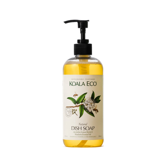 Koala Ecos Natural Dish Soap comes in a clear pump bottle featuring leaf and flower illustrations, celebrating Australian essential oils. The soap is infused with Australian Lemon Myrtle & Mandarin, and its golden yellow liquid shimmers with vibrant essence.