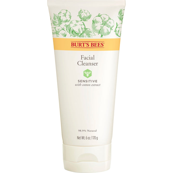 Burts Bees Sensitive Facial Cleanser for dry skin comes in white packaging with green cotton illustrations and a yellow label. Featuring soothing cotton extract, it is 98.9% Natural, ensuring gentle care for sensitive skin.