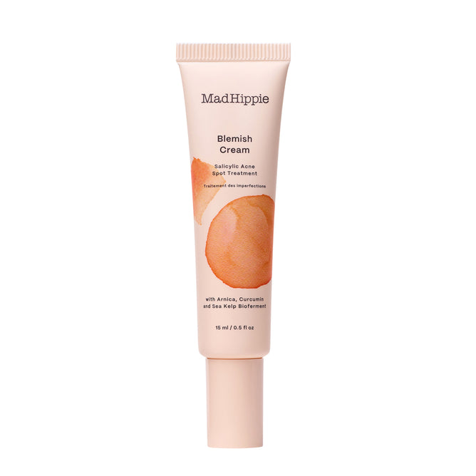 The 15 ml peach-colored Mad Hippie Blemish Cream tube, with artwork of two peaches, is ideal for exfoliating breakouts. It features salicylic acid spot treatment and is enriched with arnica, curcumin, and sea kelp bioferment.