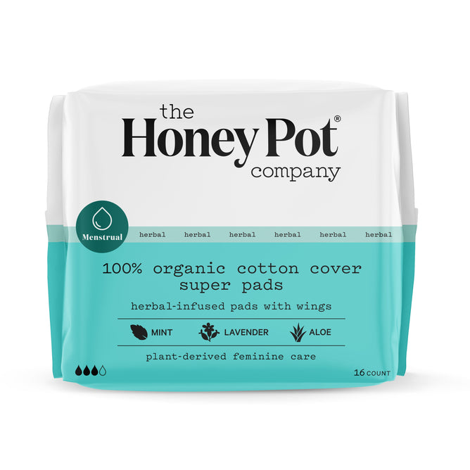 A pack of 16 Herbal-Infused Super Menstrual Pads by The Honeypot Company features a teal and white design with mint, lavender, and aloe. These pads have a 100% organic cotton cover and ultra-absorbent pulp core.