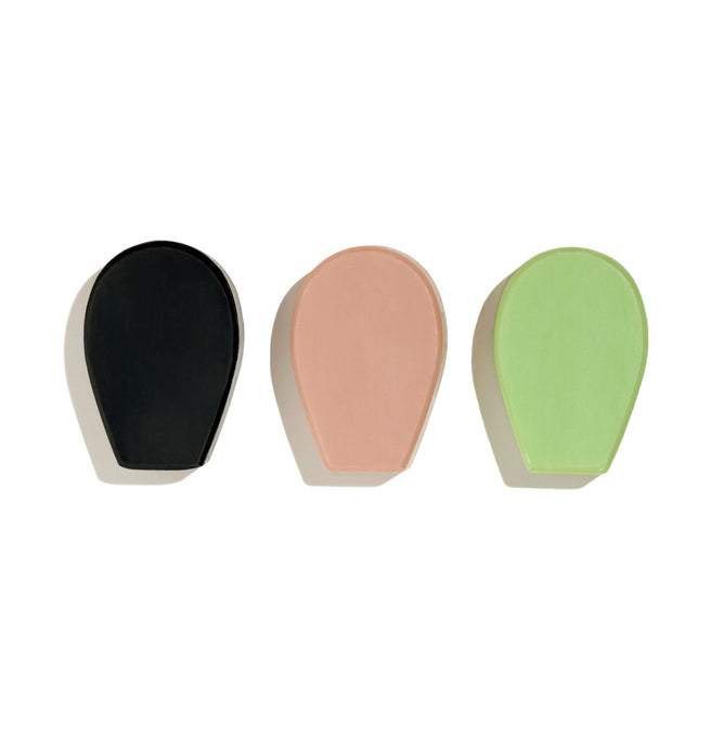 The Cactus Soap Minis Trio Gift Set by NOPALERA features three artisanal, minimalist oval-shaped hooks in black, pastel pink, and pastel green, aligning horizontally and casting gentle shadows on a white background.