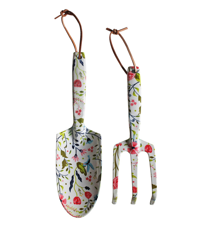 The Garden Tool Set by Womanswork includes a trowel and hand fork, both featuring leather hanging loops and adorned with the Garden of Paradise floral pattern on a white background.