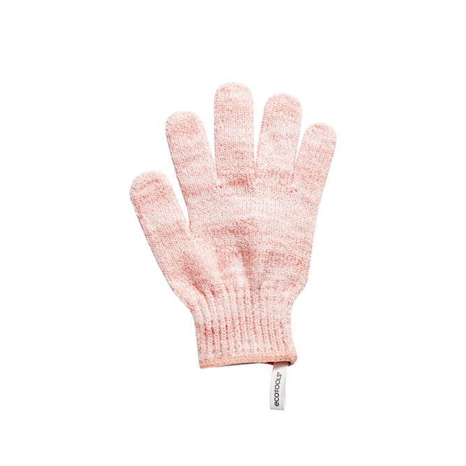 An Exfoliating Glove in pink by EcoTools lays flat on a white background. This cruelty-free and vegan bath accessory is stylish and eco-friendly, making it a sustainable choice for your self-care routine.