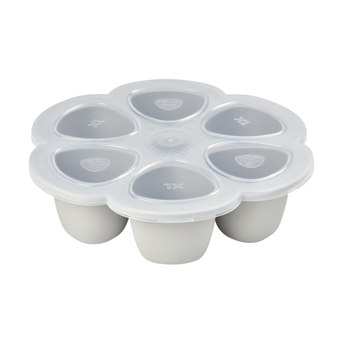 The BEABA Multiportions™ Silicone Baby Food Freezer Tray is a white, platinum-grade accessory with six compartments and transparent lids featuring a heart logo and XL. Its ideal for storing baby food and complements the Babycook for meal organization.