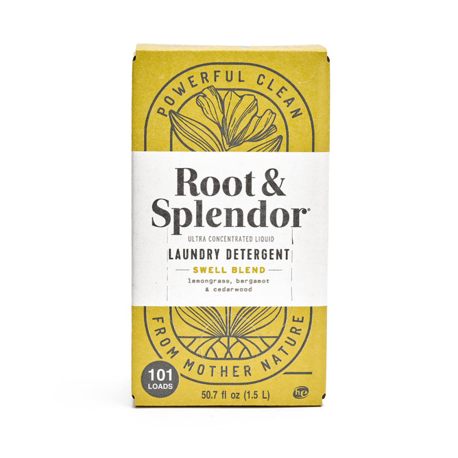 A rectangular box of Root & Splendors Concentrated Laundry Detergent in Swell Blend features all-natural ingredients. The yellow packaging has floral graphics and reads Powerful Clean from Mother Nature. It offers 101 loads and contains 50.7 fl oz (1.5 L).