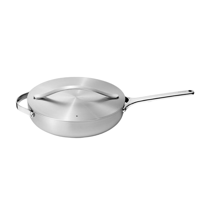 The Caraway Stainless Steel Sauté Pan, 4.5 qt, features a long handle and matching lid with an arched grip. Its modern design includes a sleek finish and 5-ply construction for excellent heat distribution.