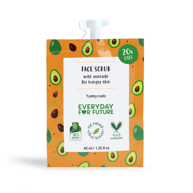 A sachet of Yummycado Face Scrub features avocado illustrations on a green and orange background. Text reads Face Scrub with avocado for hungry skin, Everyday for Future, and 20x uses. Icons highlight 50% less plastic, vegan skincare, cruelty-free, and natural ingredients. 40 ml.