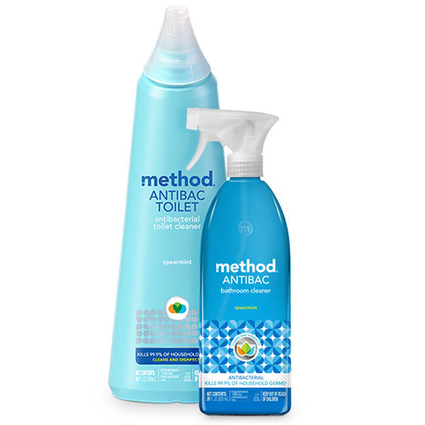 Displayed are two method cleaning products: a tall, conical-top blue bottle of Toilet Cleaner and a blue trigger-nozzle spray bottle of Antibac Bathroom Cleaner. Both feature antibacterial properties.