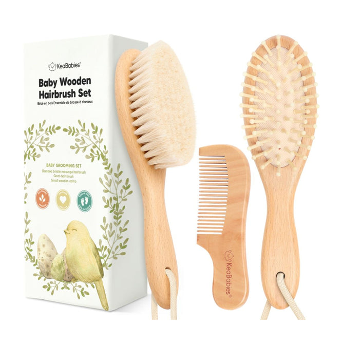 The Baby Hair Brush and Comb Set by KeaBabies comprises a soft bristle brush, wooden comb, and massager brush. The sustainable packaging features natural illustrations like a bird and highlights its effectiveness against cradle cap.