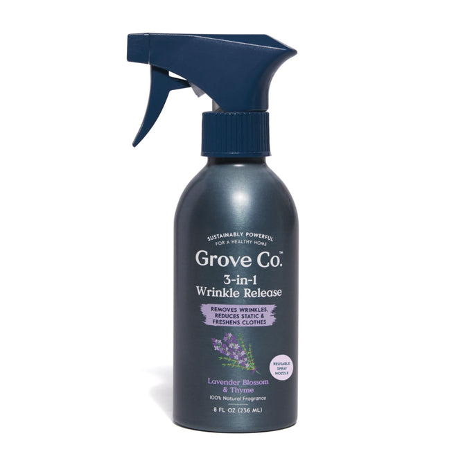 The Grove Collaborative 3-in-1 Wrinkle Release, in a sleek dark blue aluminum bottle, offers ultimate convenience by removing wrinkles, reducing static, and refreshing clothes with a soothing Lavender Blossom & Thyme scent. The bottle holds 8 fl oz (236 ml).