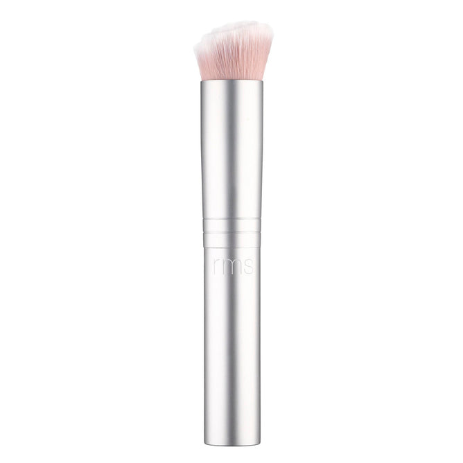 The RMS Beauty Skin2Skin Foundation Brush is sleek and silver with soft, dense white bristles and a cylindrical handle engraved with rms. It offers dual technology for seamless, flawless application of foundation or other cosmetics.