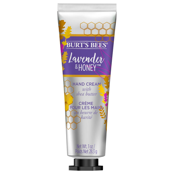 Burts Bees Hand Cream with Shea Butter, labeled Lavender & Honey, showcases honeycomb designs and yellow lavender on a purple background. This 1 oz (28.3g) natural lotion is ideal for nourishing your skin on the go.