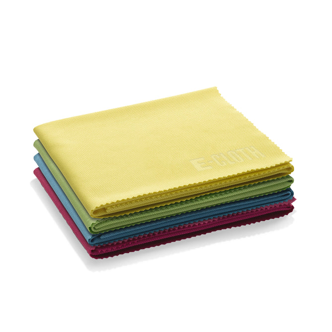Neatly folded microfiber cleaning cloths in yellow, green, red, blue, and teal are arranged on a reflective white surface. The top yellow Glass & Polishing Cloth by E-Cloth promises a streak-free shine, perfect for adding sparkle to any space.