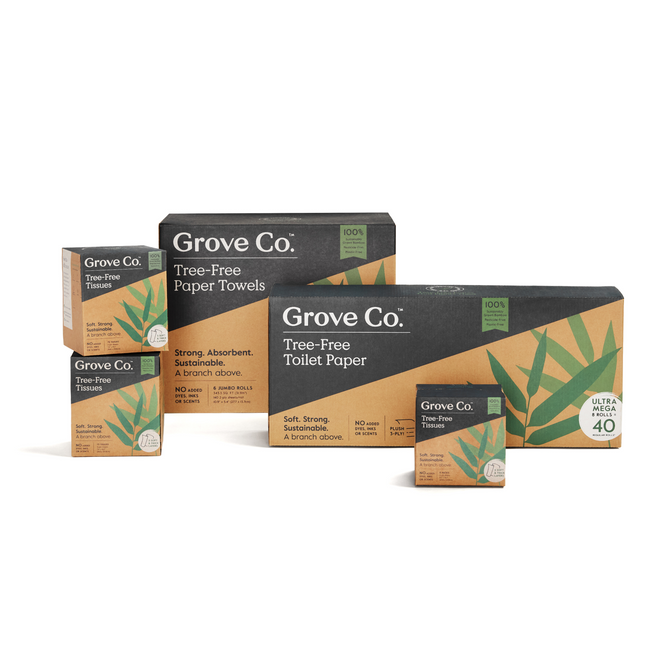 The packaging of Grove Co.s Tree-Free Household Paper Starter Set - Monthly Supply features sustainable bamboo paper products. The brown boxes, adorned with green leaf designs, emphasize sustainability and product features.