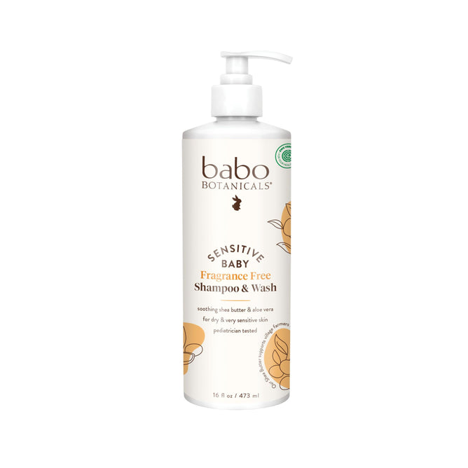 The white bottle of Babo Botanicals Sensitive Baby Shampoo & Wash features a pump and floral graphics, holds 16 fl oz (473 ml), and is fragrance-free. Enriched with soothing shea butter and aloe vera, it’s ideal for sensitive baby skin.