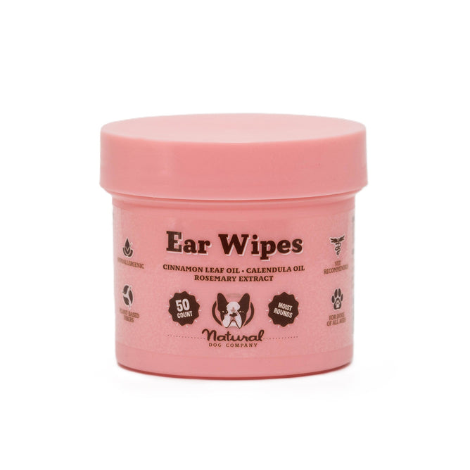 The Ear Wipes by Natural Dog Company come in a pink container with 50 hypoallergenic wipes. They use natural ingredients like cinnamon leaf oil, calendula oil, and rosemary extract for optimal dog ear care. Icons highlight vet recommendations and sustainable practices.