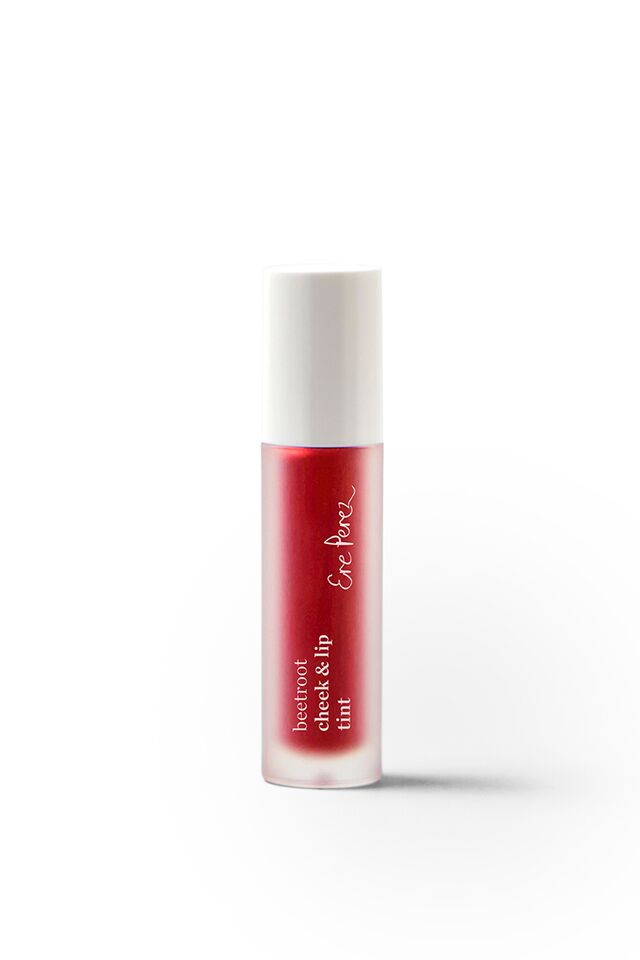 A small cylindrical bottle filled with red liquid and labeled Beetroot Cheek & Lip Tint by Ere Perez features a minimalist design with decorative writing, a white cap, and the natural touch of beetroot extracts against a plain white background.