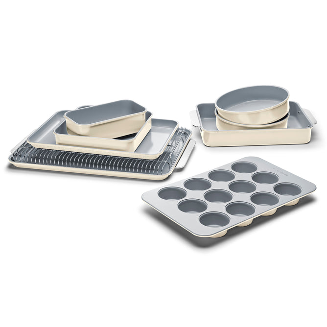 Discover Caraways 11-Piece Ceramic Bakeware Set, including muffin tins, circular pans, rectangular trays, and a cooling rack. Each piece features a sleek light cream exterior and is ceramic-coated for a stylish, toxic-free baking experience.