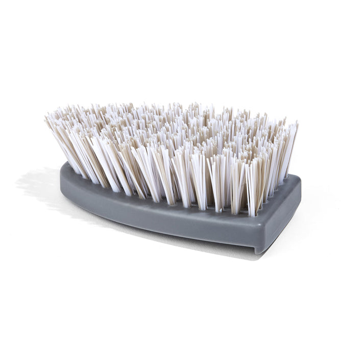 The Tub Handler Deep Cleaner Scrubber Head by Grove Co., featuring a gray handle and densely packed white bristles, rests on its side against a plain white background as a build-up banisher.