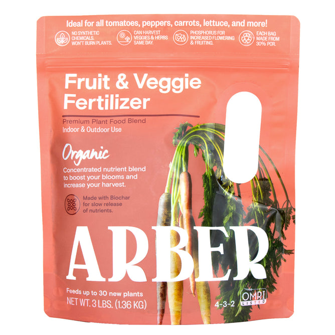 Arbers Organic Fruit & Veggie Fertilizer, in a pink 3 lb package featuring carrots, offers an organic blend with biochar for enhanced soil health. Perfect for tomatoes, peppers, and carrots, it nourishes up to 30 plants efficiently.