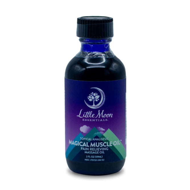A small bottle from Little Moon Essentials features a purple-to-blue gradient design labeled Magical Muscle Oil™. The white text reads Pain Relieving Massage Oil, crafted with natural ingredients for soothing relief and topped with a sleek black cap.