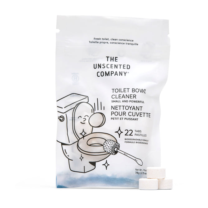 A pack of Toilet Bowl Cleaning Tabs (VIP Discount) by The Unscented Company showcases a charming toilet illustration. The white bag holds 22 biodegradable tabs made from natural ingredients, featuring a minimalist black and white design with three tabs displayed externally.
