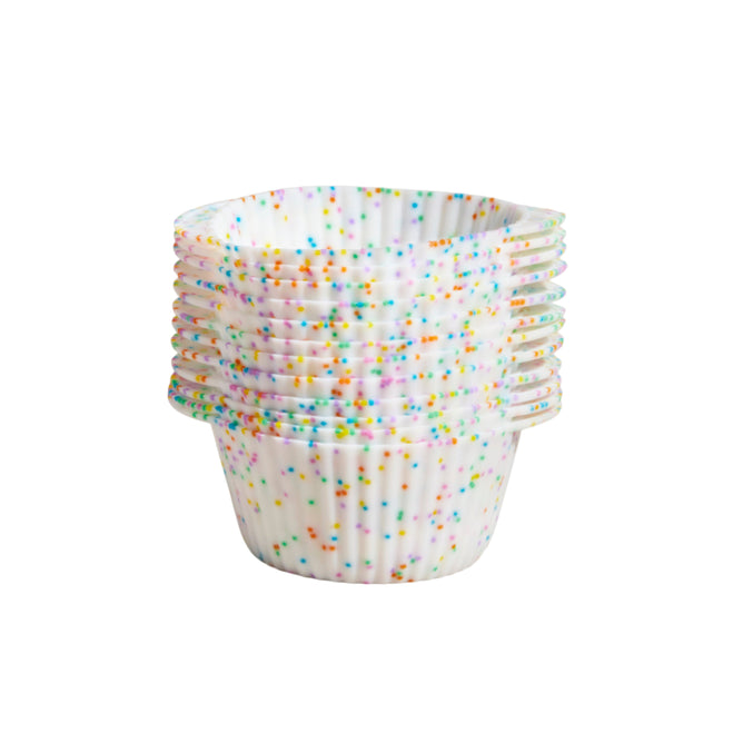 A stack of GIRs colorful, eco-friendly silicone Cupcake Liners is neatly arranged, each featuring a white base with multicolored dots for a festive touch, and sitting on a plain white background to promise vibrant baking possibilities.