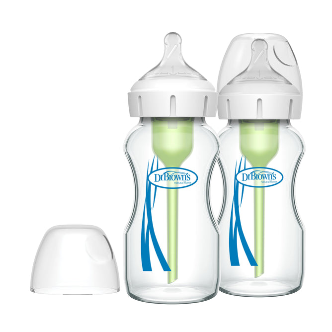 Two Dr. Browns Natural Flow Anti-Colic Options+ Wide-Neck Glass Baby Bottles with blue designs feature a vent system and clear nipples. One cap is removed, showcasing the innovative design that prioritizes your babys comfort.