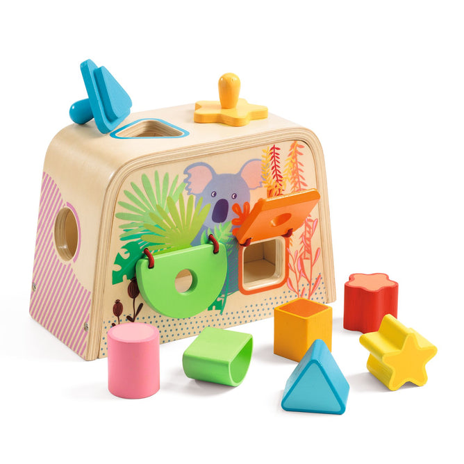 The Multi Sensory Wooden Shape Sorter Toy by DJECO, made from FSC® Certified Wood, features a charming koala with plant designs. This educational toy includes vibrant geometric shapes such as stars, circles, triangles, and squares to inspire learning through play.