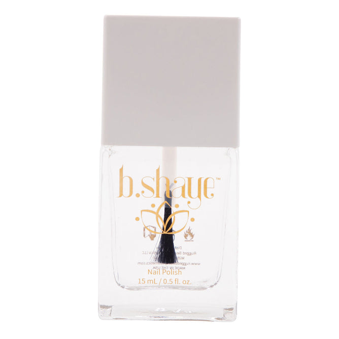 The clear bottle of b.shayes Exhale Breathable Top Coat features a gray square cap, gold text, and a flower design. It holds 15 mL (0.5 fl. oz.) of non-toxic polish with a black and white brush, epitomizing cruelty-free beauty in every stroke.