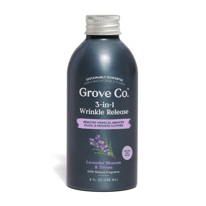 The 8 fl oz dark gray bottle of Grove Co. 3-in-1 Wrinkle Release Refill uses a natural lavender blossom and thyme fragrance to reduce wrinkles, eliminate static, and freshen clothes while being branded as sustainably powerful with plastic-free packaging.