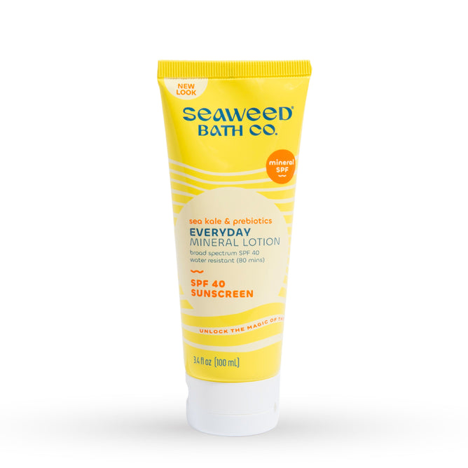 The Seaweed Bath Cos Everyday Mineral - SPF 40 comes in a yellow and white tube, featuring sea kale and prebiotics for skin nourishment. It offers broad spectrum SPF 40 protection, is water-resistant for 80 minutes, and contains 3.4 fl oz (100 ml).