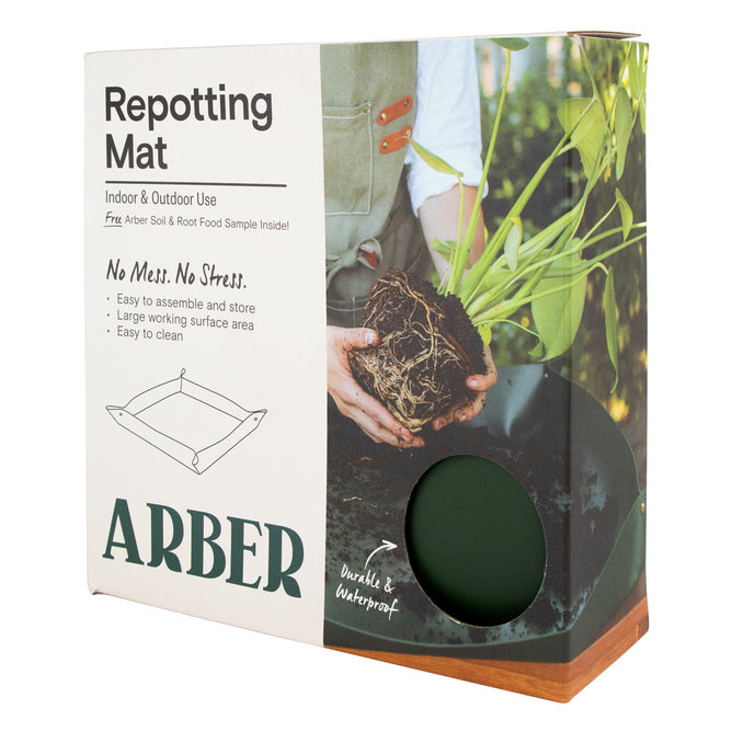 The Arber Repotting Mat packaging features hands managing plant roots, illustrating its easy use. Its eco-friendly and durable design ensures a mess-free experience, ideal for indoor/outdoor use and complements your Organic Soil & Root Food routine perfectly.