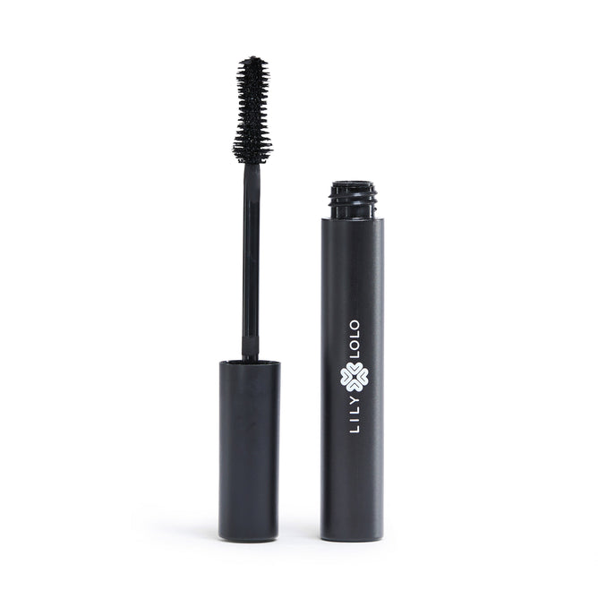 The Lily Lolo Big Lash Mascara is displayed with its opened black tube and brush applicator beside it, featuring the Lily Lolo logo in white. This vegan, natural mascara has its black-coated brush set against a plain white background.