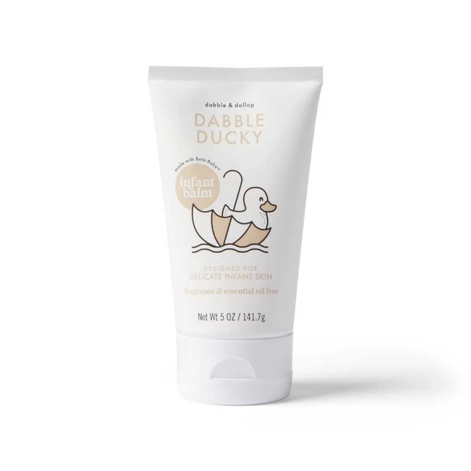 The white tube of Dabble & Dollops Dabble Ducky Infant Balm, featuring a cute duck in a bathtub, is fragrance and essential oil-free. This 5 oz (141.7g) EWG-verified balm is crafted for delicate infant skin, making it perfect for your babys gentle care routine.