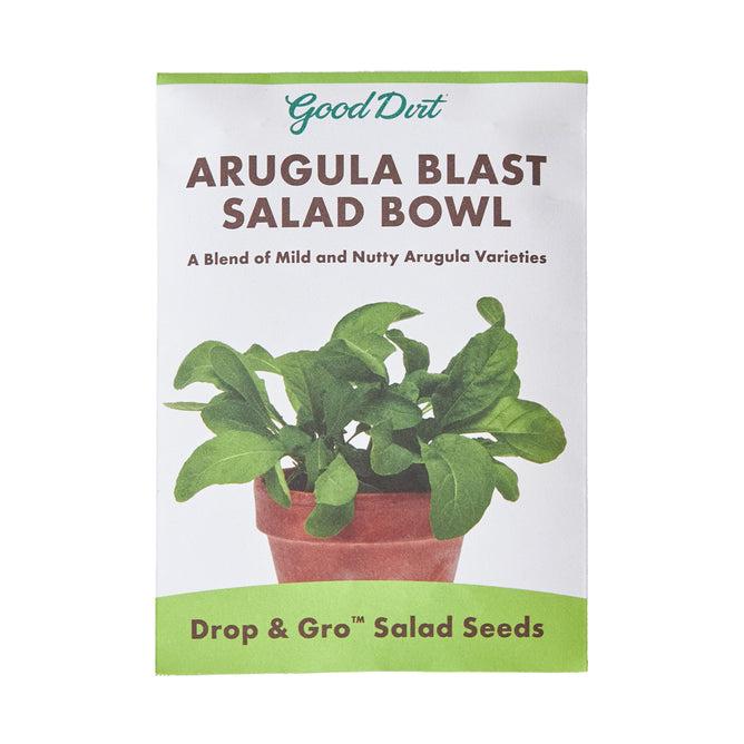 The Seed Pack - Arugula Blast Salad Bowl by Good Dirt shows arugula flourishing in a pot, with text stating: A Blend of Mild and Nutty Arugula Varieties and Drop & Gro™ Seed Pod for Effortless Growing.