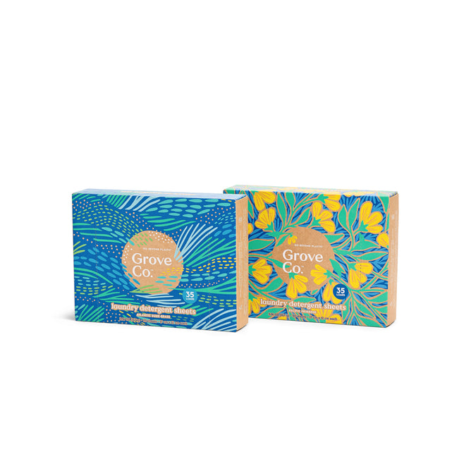 Two boxes of Laundry Detergent Sheet Set - Spring Collection by Grove Collaborative are displayed. The left box has a blue and green leafy design, while the right shows a yellow flower with green leaves. Both indicate they contain 35 sheets.