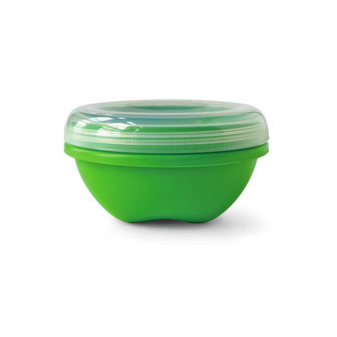 The Preserve Food Storage Round Small is a green, round container made from recycled plastic. It features a clear, ribbed lid and offers BPA-free design for safe, airtight sealing, all against a pristine white background.