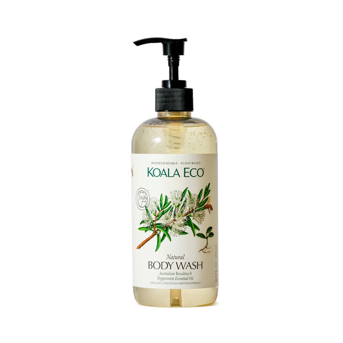 Koala Ecos Natural Body Wash comes in a clear pump bottle with a eucalyptus branch-illustrated label, featuring the text Lemon Scented Eucalyptus Body Wash. Inside is a light yellow liquid infused with Australian essential oils.