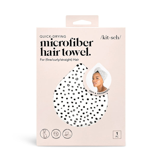The Kitsch Microfiber Hair Towel packaging highlights its luxurious softness, skin-friendly qualities, and suitability for fine, curly, or straight hair. The box features a polka dot design and an illustration of someone with the towel wrapped around their head.