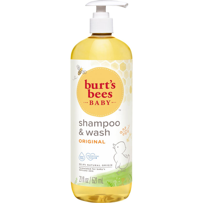 A 21 fl oz bottle of Burts Bees Baby™ Shampoo and Wash features a bee, honeycomb pattern, and duck, offering a tear-free formula with 98.9% natural ingredients, perfect for gentle bath times.