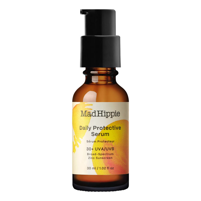 A brown pump bottle labeled Mad Hippie Daily Protective Serum showcases an abstract yellow and orange design and contains mineral SPF 30+ UVA/UVB Broad-Spectrum Zinc Sunscreen. Its enriched with nourishing buriti oil. Size: 30 ml / 1.02 fl oz.