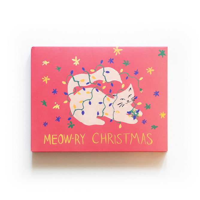 Suprise loved ones this holiday with Supra Enduras eco-friendly Holiday Cards - Cat, featuring whimsical artwork of a white cat tangled in Christmas lights. Cheerful Meow-ry Christmas in yellow and small stars complete the festive pink design.
