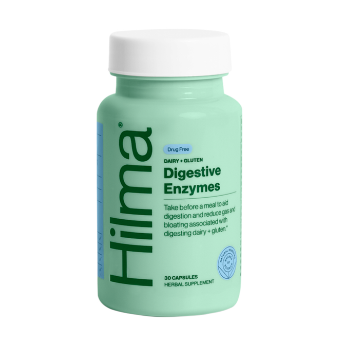 A green bottle labeled Hilma Dairy + Gluten Digestive Enzymes holds 30 capsules. This drug-free, herbal supplement aids in dairy and gluten digestion, reducing gas and bloating.