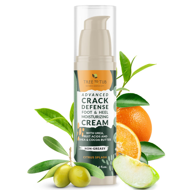 A bottle of Tree To Tub Advanced Crack Defense Deep Moisturizing Heel & Foot Cream, non-greasy with a citrus splash scent, is showcased with green leaves, sliced lime, orange, and olives to emphasize its natural ingredients for dry cracked heels.